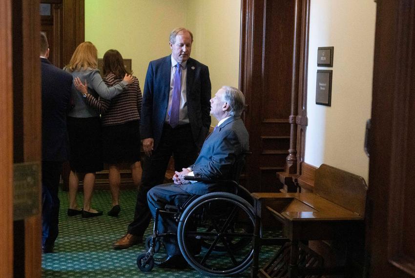 Opening Day action of the 88th Texas Legislature at the Texas Capitol showing Attorney General Ken Paxton conferring with Gov. Greg Abbott outside the Senate chamber before his swearing in ceremony in Jan. 10, 2023.