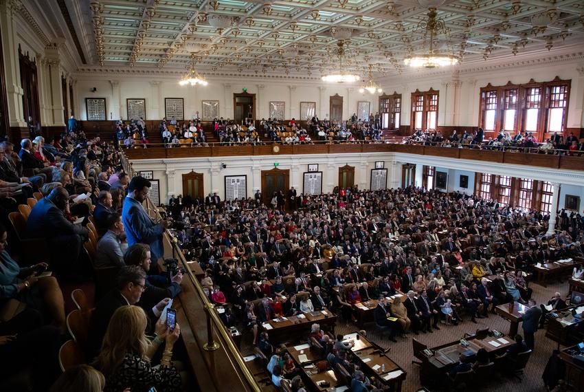 State Representatives and their families sit on the House floor on the opening day of the 88th Legislative Session at the state Capitol in Austin on Jan. 10, 2023.