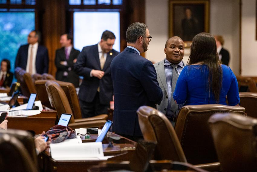 State Rep. Venton Jones, D-Dallas, speaks with fellow lawmakers on the House floor on April 6, 2023.