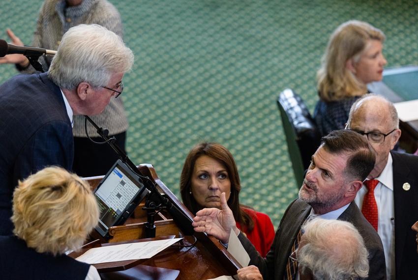 State Sen. Brandon Creighton, R-Conroe, speaks with Lt. Gov. Dan Patrick on the Senate floor during the first day of the second special session at the state Capitol in Austin, on June 28, 2023.
