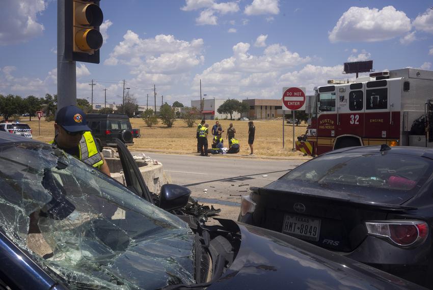 Austin-Travis County EMTs and Austin Fire Dept. EMTs respond to a car accident in South Austin on July 24, 2023.