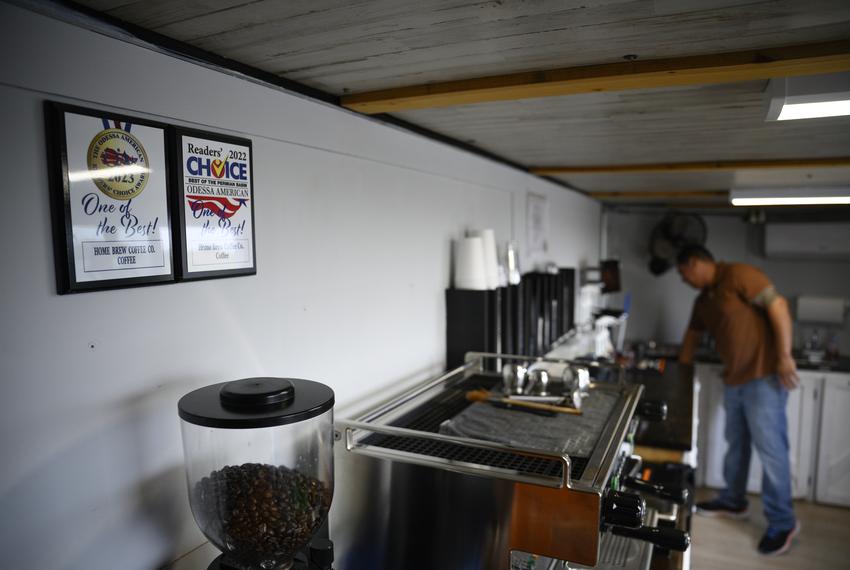 Local business recognition awards hang on the wall of Fabian Maldonado’s mobile coffee shop Homebrew Coffee Co. as he cleans up his work station between customers Thursday, Sept. 14, 2023 in Odessa.