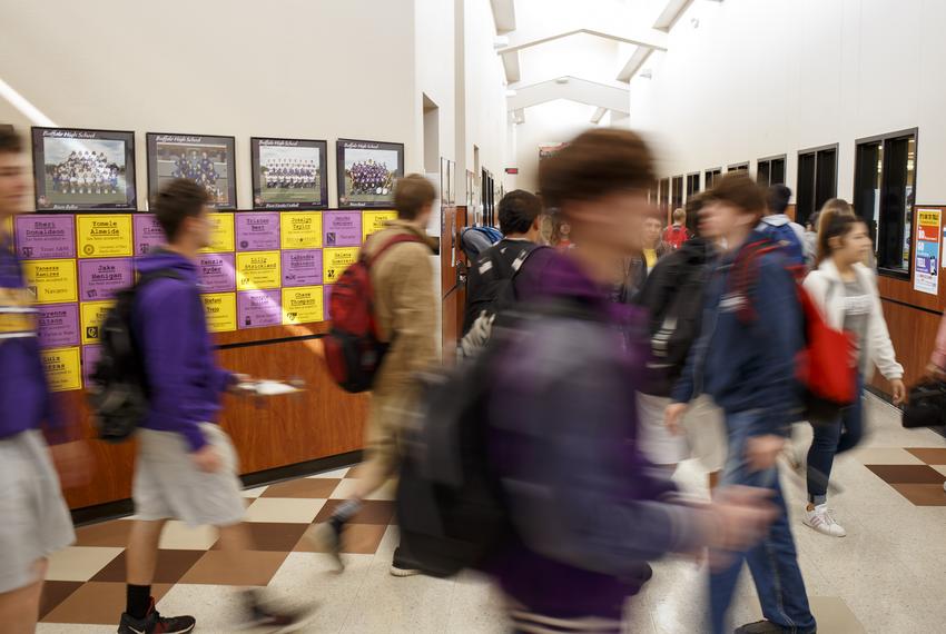 High school students between classes in the hallway at the high school in Buffalo on March 28, 2019.