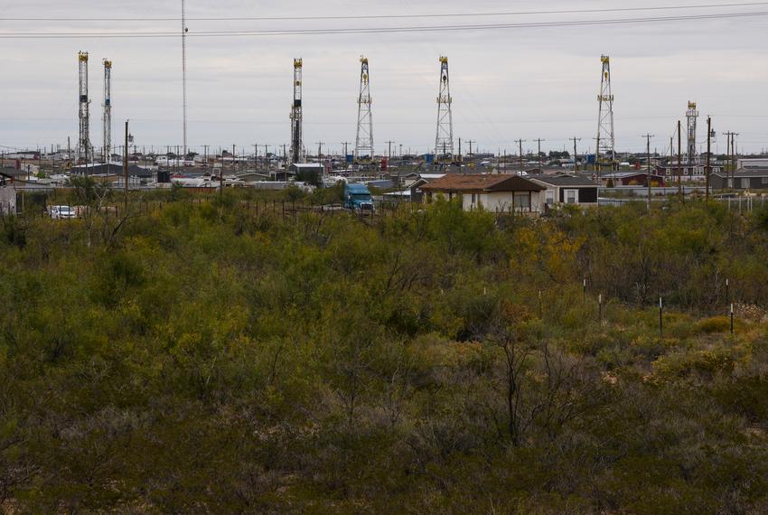 An oil rig storage yard is seen beyond the Knox Village neighborhood Friday, Nov. 10, 2023, in West Odessa.