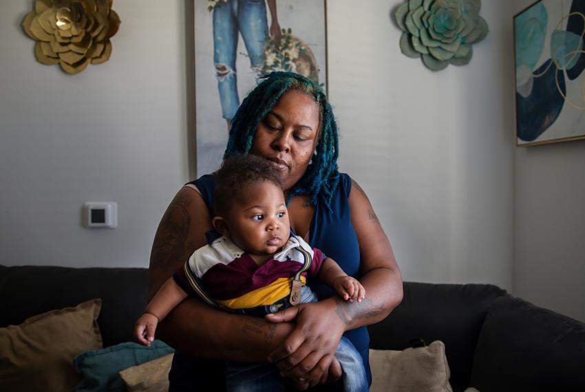 Connie Bunch with her 6-month-old son Aiden in her home in Austin, Texas, on July 6.