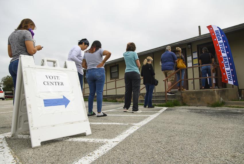 Voters line up outside of the Hays County Independent School District Arnold Transportation Building voting center to cast their vote in the Texas General Elections on Tuesday, Nov. 8, 2022 in Kyle.