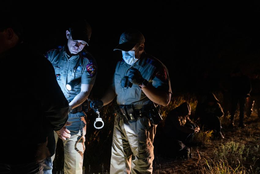 State Troopers arrest an undocumented Mexican migrant for trespassing as part of Operation Lone Star after he was caught with others in private property in Kinney County, on Nov. 9, 2021.
