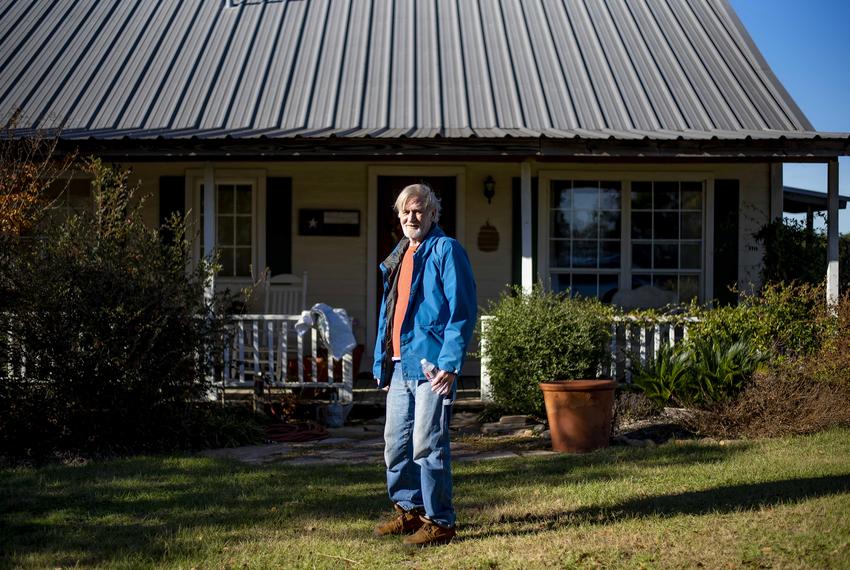 David Wilshusen, 69, stands outside his home in Houston County, Texas on on Wednesday, November 30, 2022. (Emil Lippe for The Texas Tribune)
