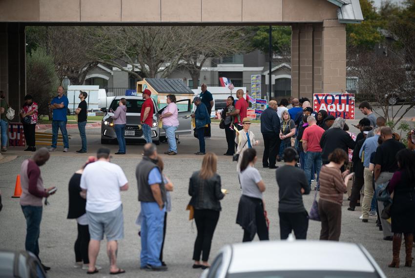 Travis County residents wait in line to vote at the County Tax Office polling location on Tuesday, March 3, 2020, in Pflugerville.