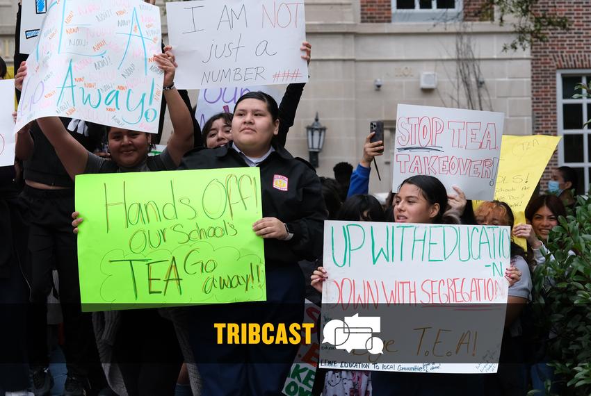 Students at Houston’s Northside High School hold up signs in protest of the state takeover of HISD on April 6, 2023.