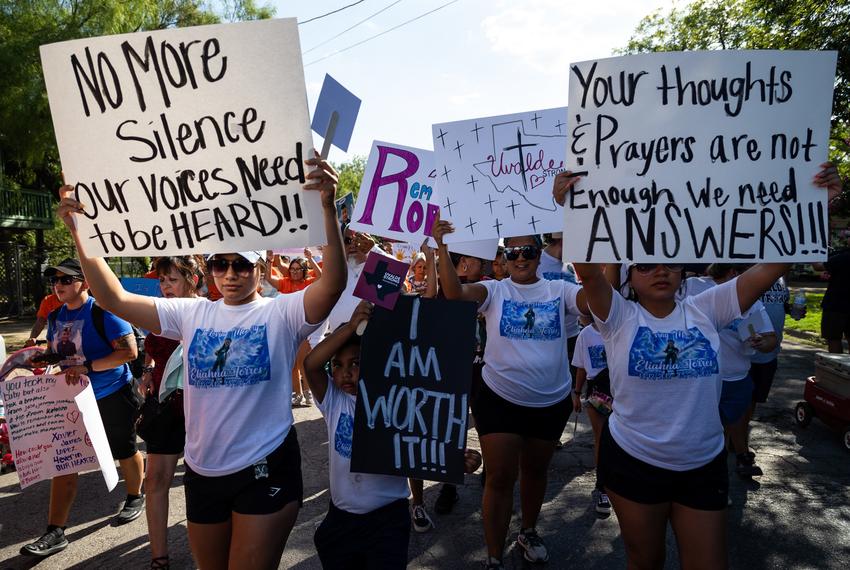 Family members and friends participate in a march in support of those killed and injured in the school shooting at Robb Elementary, in Uvalde on July 10, 2022.